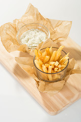 Image showing Fried potato chips in the glass 