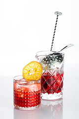 Image showing Amber cocktail in a glass isolated on white background