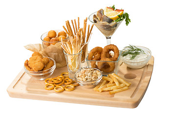 Image showing set of different salty snacks. 