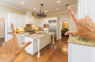 Image showing Hands Framing A Beautiful Custom Kitchen