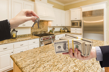 Image showing Handing Over Cash for Keys Inside Beautiful Kitchen