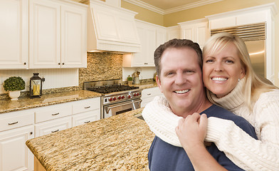 Image showing Happy Couple Inside Beautiful Custom Kitchen