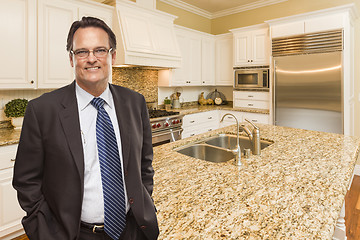 Image showing Man Wearing Necktie in Beautiful Custom Residential Kitchen