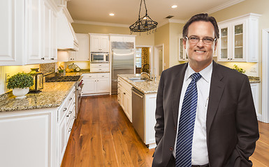 Image showing Man Wearing Necktie in Beautiful Custom Residential Kitchen