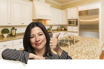 Image showing Hispanic Woman with Thumbs Up In Custom Kitchen Interior
