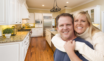 Image showing Happy Couple Inside Beautiful Custom Kitchen