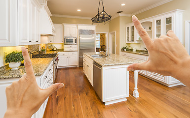 Image showing Hands Framing A Beautiful Custom Kitchen