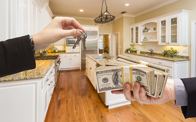 Image showing Handing Over Cash for Keys Inside Beautiful Kitchen