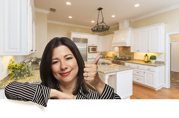 Image showing Hispanic Woman with Thumbs Up In Custom Kitchen Interior