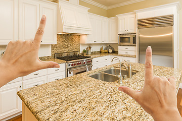 Image showing Hands Framing A Beautiful Custom Kitchen