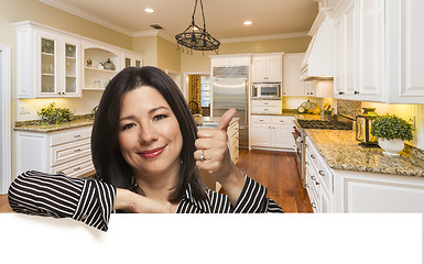 Image showing Hispanic Woman with Thumbs Up In Custom Kitchen Interior