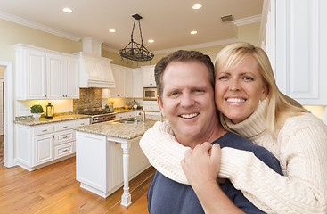 Image showing Happy Couple Inside Beautiful Custom Kitchen