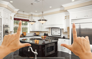 Image showing Hands Framing A Beautiful Custom Kitchen