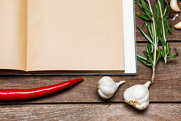 Image showing Open blank recipe book on brown wooden background