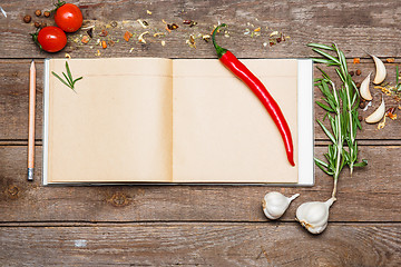 Image showing Open blank recipe book on brown wooden background