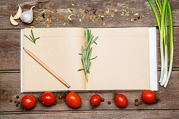 Image showing Open blank recipe book on brown wooden background