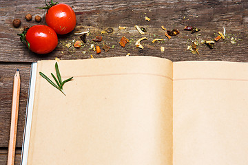 Image showing Open blank recipe book on brown wooden background