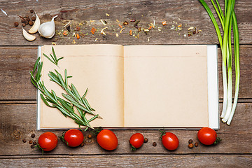 Image showing Open blank recipe book on brown wooden background