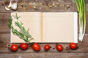 Image showing Open blank recipe book on brown wooden background