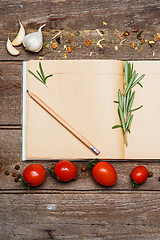 Image showing Open blank recipe book on brown wooden background