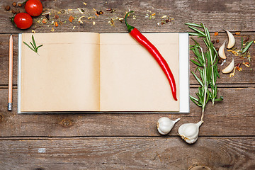 Image showing Open blank recipe book on brown wooden background