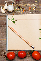 Image showing Open blank recipe book on brown wooden background