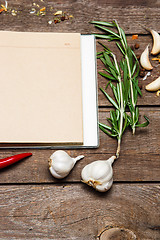 Image showing Open blank recipe book on brown wooden background