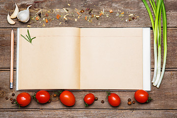 Image showing Open blank recipe book on brown wooden background