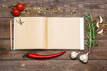 Image showing Open blank recipe book on brown wooden background