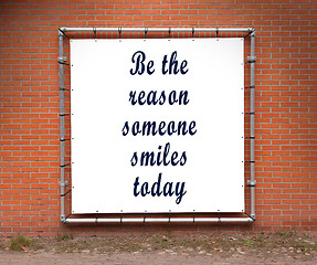 Image showing Large banner with inspirational quote on a brick wall