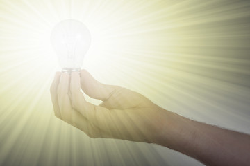 Image showing Hand holding an light bulb 