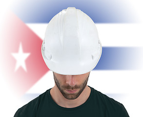 Image showing Engineer with flag on background - Cuba