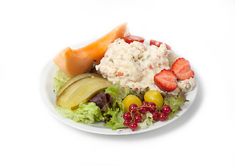 Image showing Snack time - View of Russian salad on a white plate