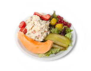 Image showing Snack time - View of Russian salad on a white plate