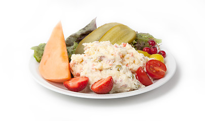 Image showing Snack time - View of Russian salad on a white plate