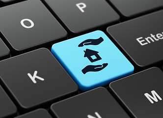 Image showing Insurance concept: House And Palm on computer keyboard background
