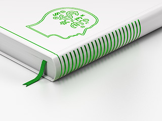 Image showing Advertising concept: closed book, Head With Finance Symbol on white background