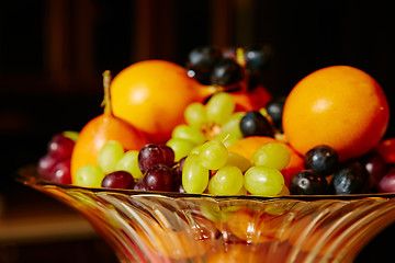 Image showing Assortment of juicy fruits on wooden table,