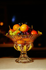 Image showing Assortment of juicy fruits on wooden table,