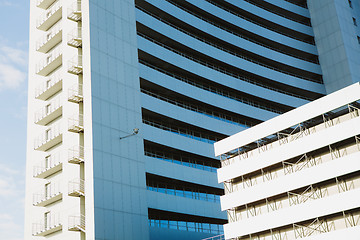 Image showing angle view to textured background of modern glass building 