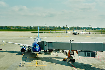 Image showing Airplane at the terminal gate ready for takeoff 