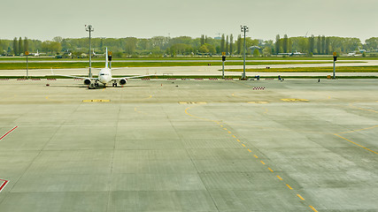 Image showing Airplane at the terminal gate ready for takeoff 