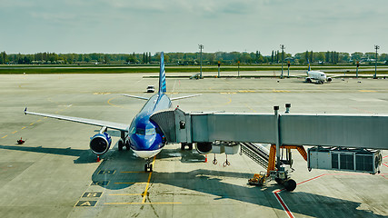 Image showing Airplane at the terminal gate ready for takeoff 