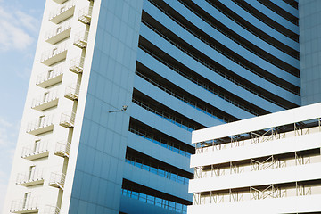 Image showing angle view to textured background of modern glass building 