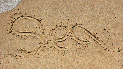 Image showing Sea word written on beach sand.