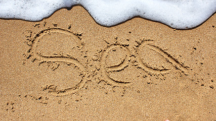 Image showing Sea word written on beach sand.