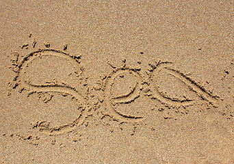 Image showing Sea word written on beach sand.