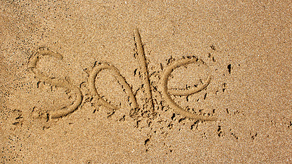 Image showing Word sale handwritten in sand