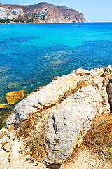 Image showing in   the mykonos island rock sea and beach blue   sky