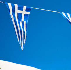 Image showing waving greece flag in the blue sky and flagpole